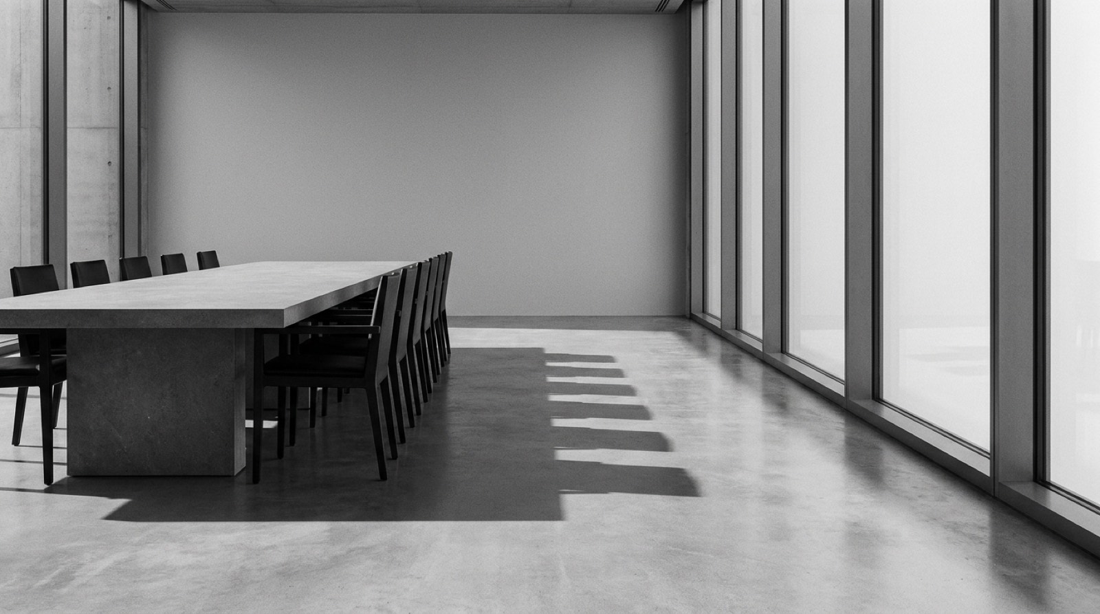 Sala de reunión contemporánea con ventanal de piso a techo.